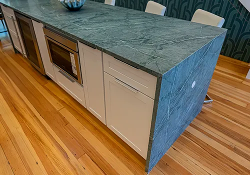 Detailed close-up of a premium stone waterfall edge profile, showcasing technical countertop finishes in our virtual edge visualizer.