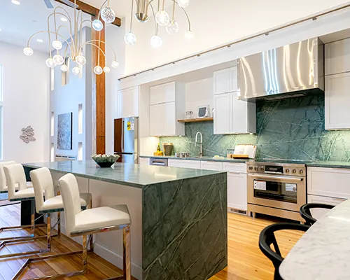 Custom kitchen countertop installation with a premium white quartz island in Peabody, MA by Costa's Stone.