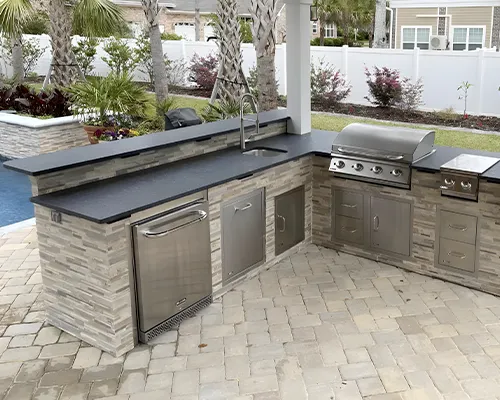 Durable natural stone countertop for outdoor kitchen and grilling area in the North Shore, MA region by Costa's Stone.