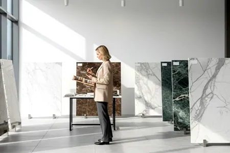 Hand-selecting premium stone slabs at the Costa's Stone showroom in Peabody, MA.