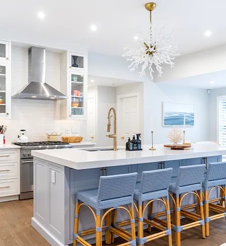 Modern white quartz kitchen countertop with mitered edge installation in Harwich Port, MA.